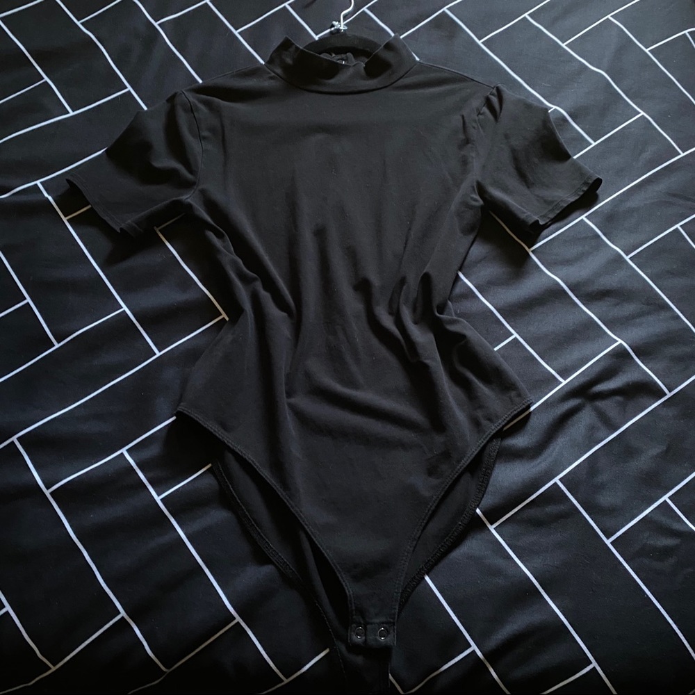 Turtle neck bodysuit.